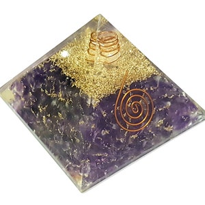May include: Amethyst crystal pyramid with gold flakes and a copper wire spiral. The pyramid is clear and has a polished finish.