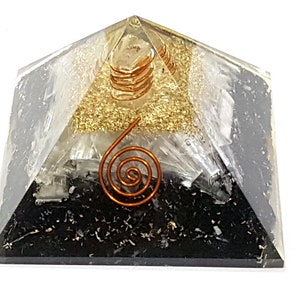 May include: A black, white, and gold layered crystal pyramid with a copper wire spiral on top. The pyramid is made of selenite, clear quartz, and black tourmaline.