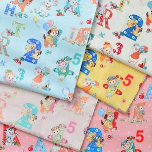 May include: A collection of five fabric panels featuring a colorful alphabet and number pattern with cute animal illustrations. The panels are in shades of blue, yellow, pink, and white.