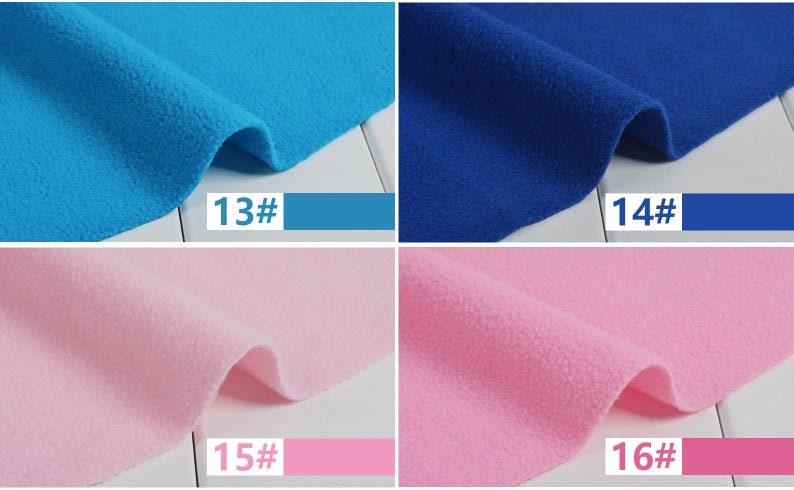 May include: Close-up of four swatches of fleece fabric in shades of blue and pink. The colors are labeled with numbers and color swatches: 13# turquoise, 14# royal blue, 15# light pink, and 16# medium pink. The fabric has a soft, textured appearance.