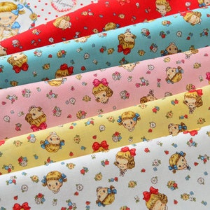 May include: Five rolls of fabric with a repeating pattern of girls with bows in their hair and small flowers. The fabric colors are red, blue, pink, yellow, and white.