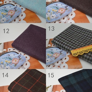 May include: A collection of 6 fabric swatches in various colours and patterns. The swatches are arranged in two rows of three. The swatches include a light blue, dark brown, purple, grey and white houndstooth, brown and orange plaid, and dark blue and green plaid.