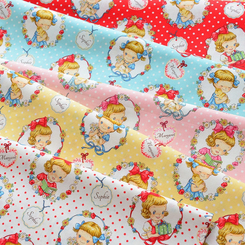 May include: Five fabric swatches with different colored backgrounds and white polka dots. Each swatch features a repeating pattern of a girl in a floral wreath holding a teddy bear or a book. The names "Sophie" and "Margaret" are printed on the fabric.