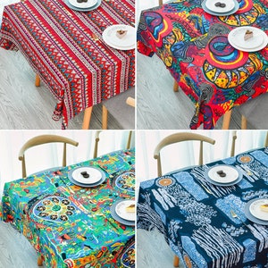 May include: Four different tablecloths with various colorful patterns. The tablecloths are made of a soft, woven fabric and feature geometric, abstract, and floral designs.