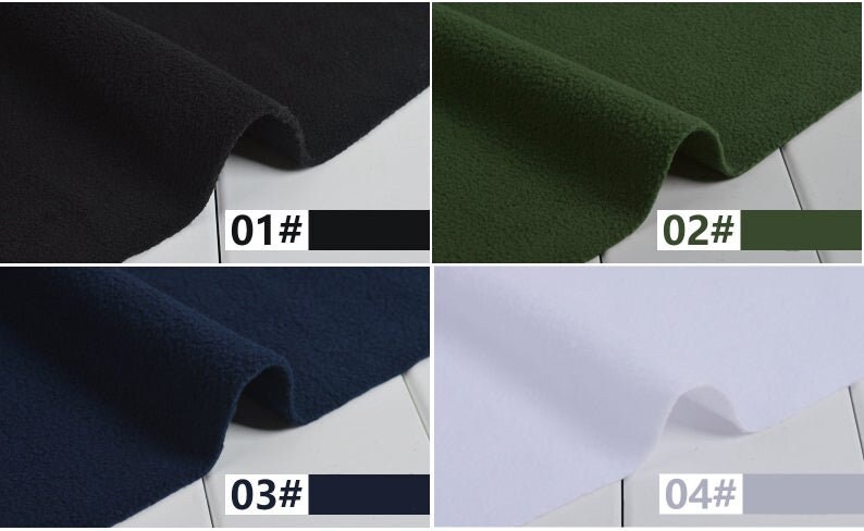 May include: A fabric sample with four color swatches: black, dark green, navy blue, and white. Each swatch is labeled with a number and color name. The fabric appears to be a soft, textured material.