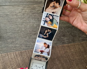 May include: A black box with a series of photos of a couple in different poses. The box is open and the photos are fanned out. The last photo in the series has the text "Always & Forever" written on it.
