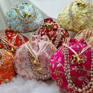 Ethnic embroidered potli handbags in bright multicolor shades with intricate floral patterns and pearl embellishments, handmade Indian wedding favor bags for guests, stylish drawstring pouch for brides, bridesmaids and party wear, perfect for gifting, storage or fashion use, traditional yet modern accessory loved by USA customers, premium quality silk potli purse for festive and cultural occasions