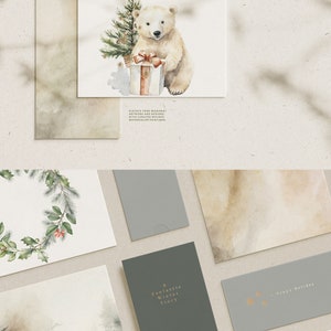May include: A selection of watercolour illustrations featuring a polar bear with a gift, a Christmas tree, and a wreath. The text "A Cosy Selection" and "Welcome the Cosy Season" are displayed. Other cards feature winter scenes and holiday greetings.