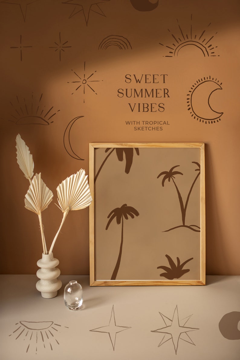 May include: A framed print featuring a brown background with a pattern of palm trees. The frame is made of wood and has a light brown finish. The print is displayed against a brown wall adorned with various hand-drawn symbols, including stars, moons, and suns. The text "SWEET SUMMER VIBES WITH TROPICAL SKETCHES" is written in brown text on the wall.