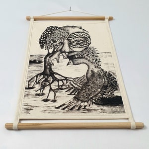 May include: Black and white illustration of a tree with a face and a bird with a face. The tree has roots and the bird has wings. The illustration is on a white canvas with a wooden frame.