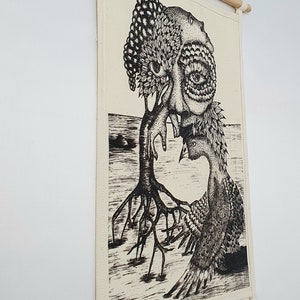 May include: Black and white illustration of a tree with a human face and a bird. The tree has roots and branches, and the bird is perched on a branch. The illustration is printed on a canvas and mounted on a wooden frame.