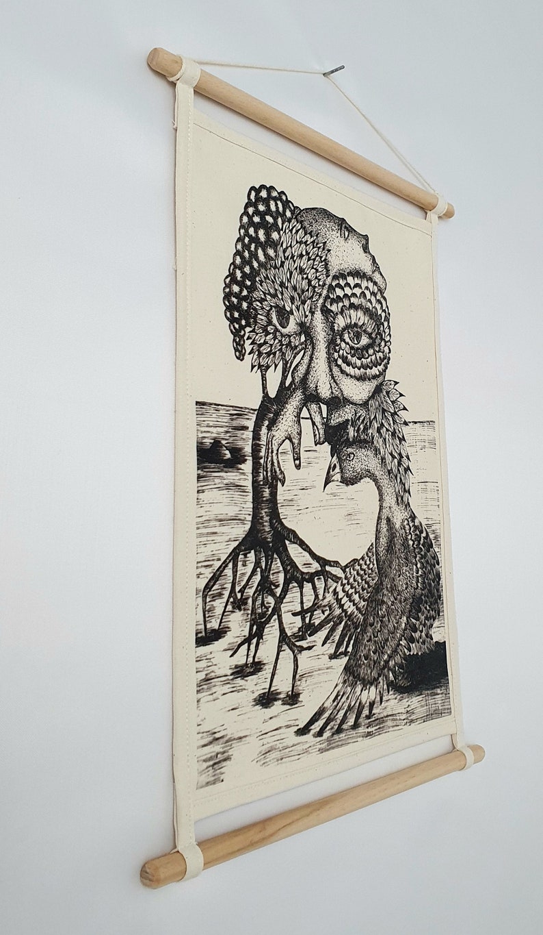 May include: Black and white illustration of a tree with a human face and a bird. The tree has roots and branches, and the bird is perched on a branch. The illustration is printed on a canvas and mounted on a wooden frame.