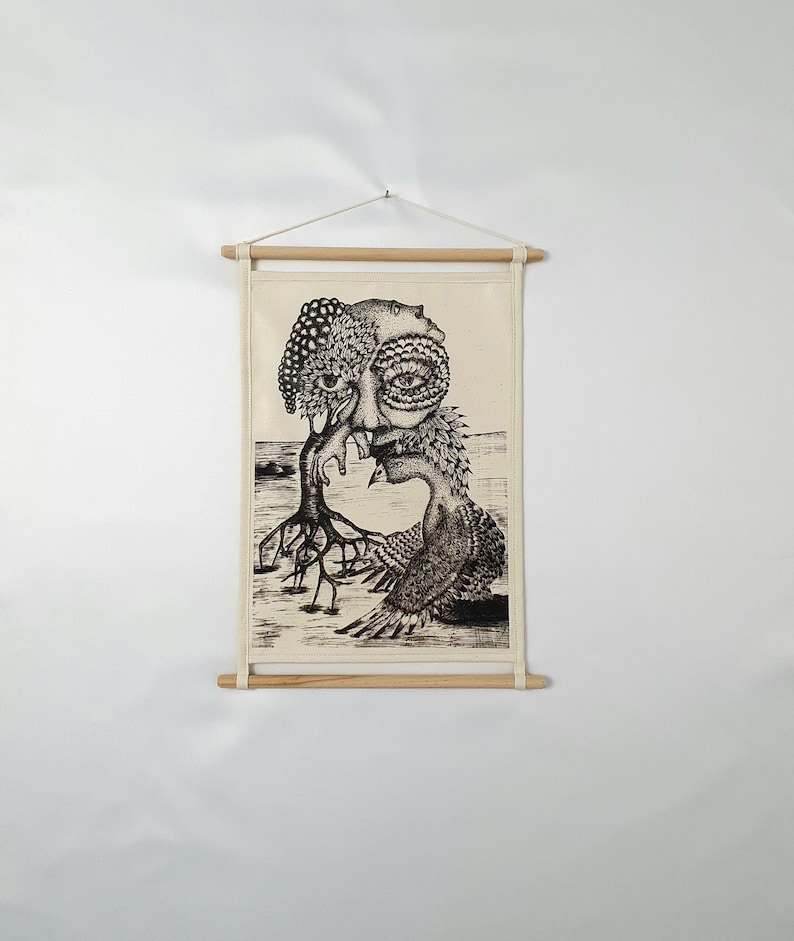 May include: Black and white surrealist drawing of a tree with a human face and a bird with a human face, printed on a canvas with wooden dowels at the top and bottom.