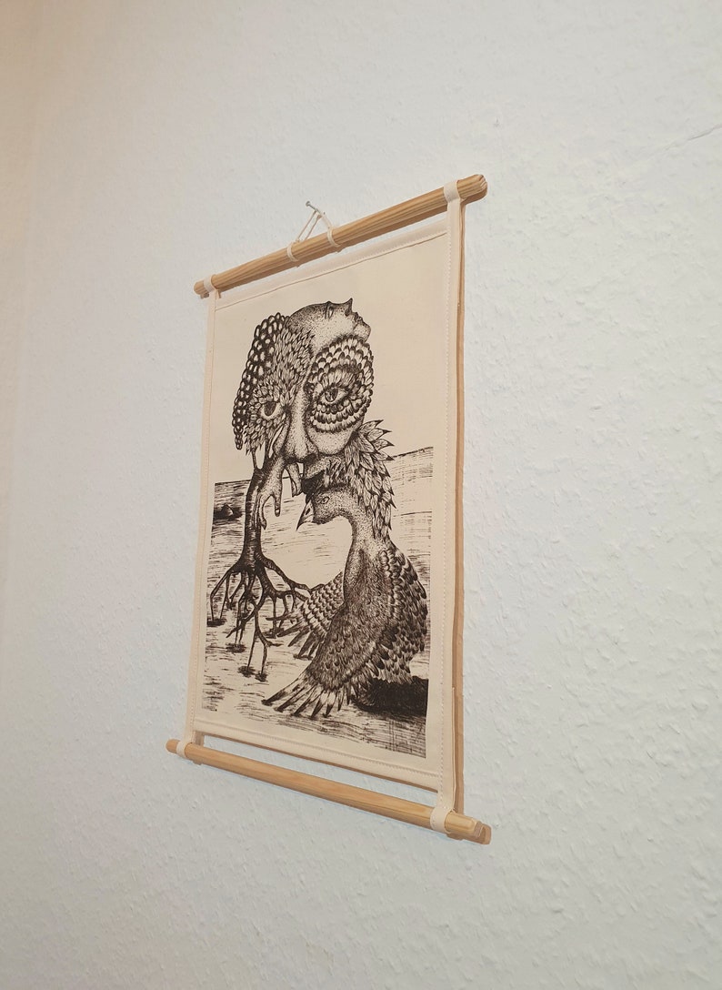 May include: A black and white illustration of a surreal creature with a human face and bird-like wings, printed on a canvas and mounted on a wooden frame.