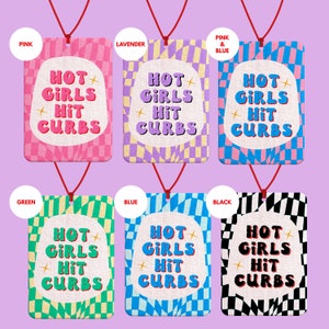 May include: Six car air fresheners with a checkered pattern and the text "Hot Girls Hit Curbs". The air fresheners are in the colors pink, lavender, pink and blue, green, blue, and black.