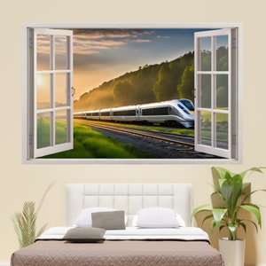 Può includere: Un treno bianco viaggia attraverso un campo verde e una foresta al tramonto. Il treno è visto attraverso una finestra con cornice bianca.