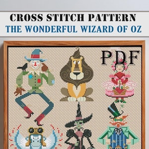 Puede incluir: Patrón de punto de cruz con personajes de El Mago de Oz. La obra de arte enmarcada incluye imágenes del Espantapájaros, el León, Glinda, la Bruja Malvada y el Hombre de Hojalata. El patrón PDF se muestra en un marco de madera.