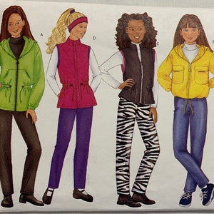 May include: A sewing pattern for girls' clothing, featuring a green hooded jacket, a pink vest, a black vest, and a yellow jacket. The pattern is for sizes 7-8, 9-10. The pattern number is 6789.
