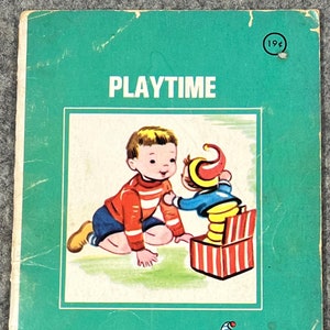May include: A vintage children's book titled "Playtime" featuring a boy playing with a jack-in-the-box toy. The book cover is green with a red and white striped box and a red and white striped jack-in-the-box. The book is published by Rand McNally and is part of the Tiny Elf series.