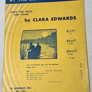 May include: A yellow sheet music cover titled By the Bend of the River by Clara Edwards. It features a blue illustration of two people in a canoe on a river at sunset, musical notation for low, medium, and high keys, and a list of choral versions.