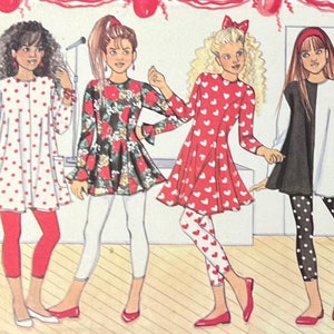 May include: Four girls wearing different outfits with leggings. The first girl is wearing a white dress with red polka dots and red leggings. The second girl is wearing a black and red floral dress with white leggings. The third girl is wearing a red dress with white hearts and red and white heart leggings. The fourth girl is wearing a black and white top with black and white polka dot leggings.