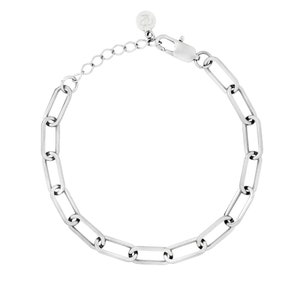 May include: Silver-toned chain bracelet with elongated rectangular links. The bracelet features a lobster clasp closure and an adjustable chain for a customized fit. A small, round charm is attached near the adjustable chain.