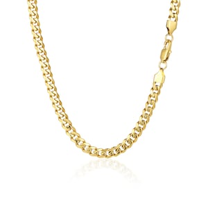 May include: A gold curb chain necklace with a lobster clasp closure.