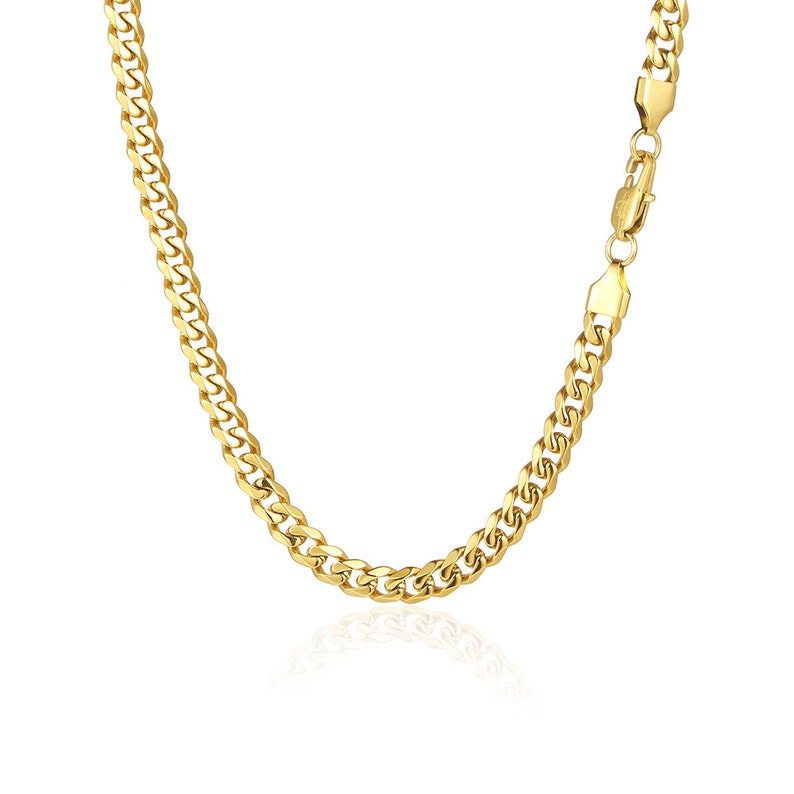 May include: A gold curb chain necklace with a lobster clasp closure.