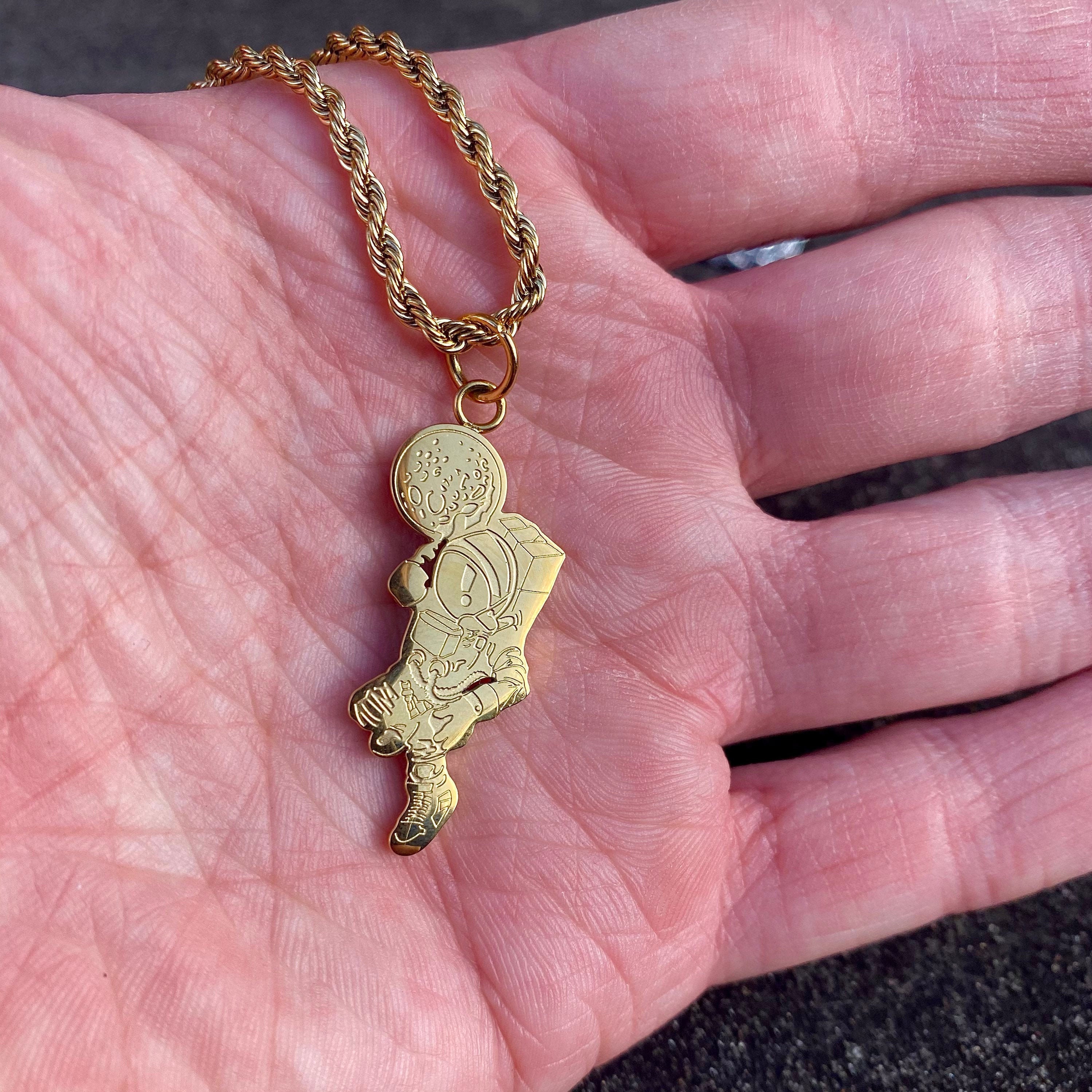 Gold astronaut best sale pendant