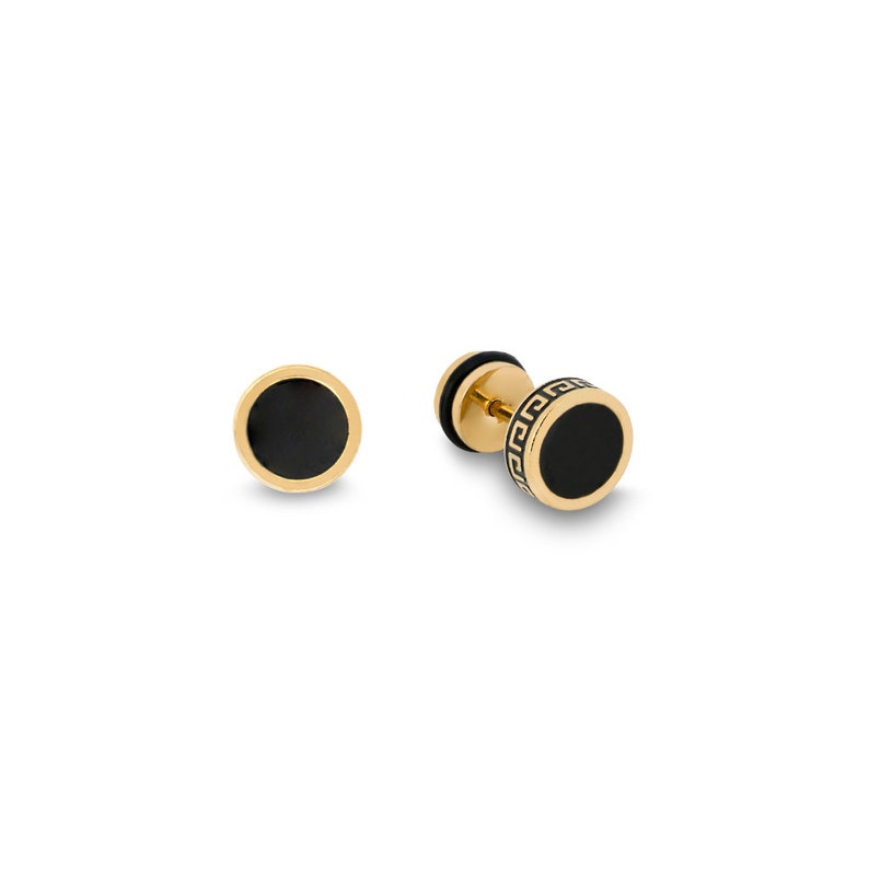 May include: A pair of gold-tone stud earrings with black enamel and a Greek key design.