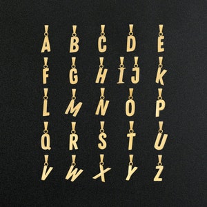 May include: Gold-colored alphabet letter pendants, A through Z, on a black background. Each letter is on a separate pendant.