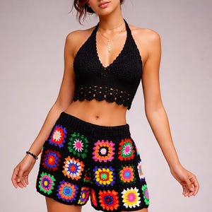 May include: Black crochet halter top and matching shorts. The shorts feature a colorful patchwork design with squares of various colors. The top has a scalloped edge. The outfit is a bohemian style.