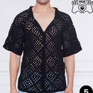 May include: Black crochet shirt with a button-up front and short sleeves. The shirt has a loose fit and is made of a lightweight, breathable fabric. "HAND MADE" is written in black text on a white background in the top right corner of the image. The number "5" is written in black text on a white circle in the bottom right corner of the image.