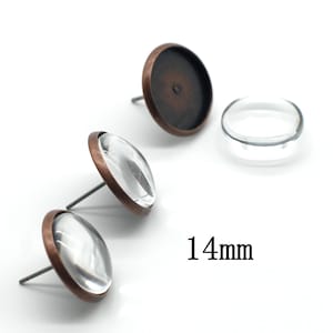 May include: Three copper-toned earring settings with clear glass inserts. The settings are 14mm in diameter.