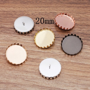 May include: Five 20mm round metal bezel settings with a decorative edge. The bezels are in silver, gold, rose gold, and black.