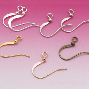 May include: Five pairs of earring hooks in different finishes: silver, gold, rose gold, and bronze. Each hook has a small ball at the top.