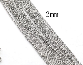 May include: Close-up of multiple strands of silver-coloured chain. The chains are thin and delicate, with a 2mm thickness. The chains are arranged diagonally, creating a textured surface. Suitable for jewellery making.