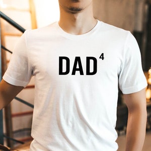 May include: White t-shirt with black text that reads "DAD^4".