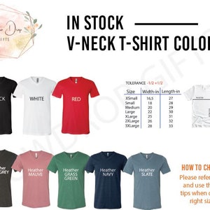 May include: A chart showing the different colors and sizes available for V-neck t-shirts. The colors include black, white, red, heather dark grey, heather mauve, heather grass green, heather navy, and heather slate. The sizes range from X-Small to 3X-Large with corresponding width and length measurements in inches.