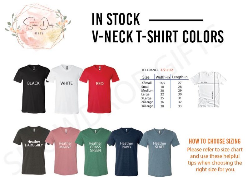 May include: A chart showing the different colors and sizes available for V-neck t-shirts. The colors include black, white, red, heather dark grey, heather mauve, heather grass green, heather navy, and heather slate. The sizes range from X-Small to 3X-Large with corresponding width and length measurements in inches.