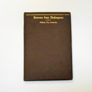 May include: A brown book with gold lettering on the cover. The title is "Sermons from Shakespeare" by William Day Simonds.