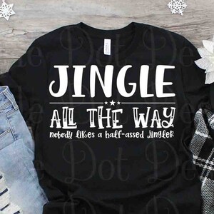 May include: Black t-shirt with white text that reads "Jingle All The Way, nobody likes a half-assed jingler".