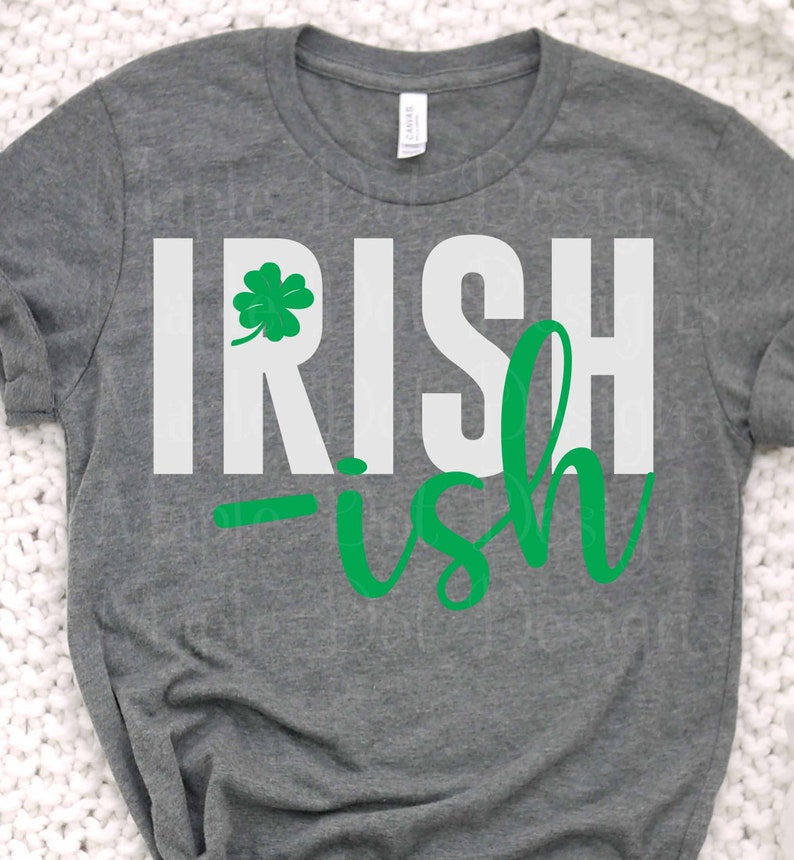 May include: A gray t-shirt with the text "IRISH-ish" in white and green. A green shamrock is above the word "IRISH".