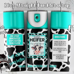 May include: A 20 oz. straight tumbler wrap with a cow print design. The wrap features a cartoon cow with the text "Listen, Heifer Stop playin with me". The wrap also includes directions for use and a warning about side effects. The text "One activation lasts a full life sentence" is also included.
