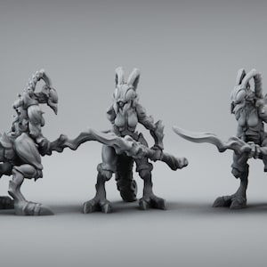 May include: Three grey, detailed, miniature figurines of humanoid creatures with insect-like features, holding swords. The figures are posed in different stances.