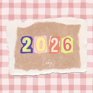 May include: A colourful collage showing the year "2026" in cut-out numbers. The numbers are set against a brown paper background with a torn edge, over a pink and white checkered pattern. The word "Lucky" is written in cursive.