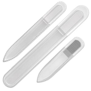 May include: Three glass nail files with white protective covers. The files are different sizes and have a pointed tip.
