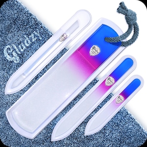 May include: Set of four glass nail files with a gradient design. The files are white with pink and blue accents. The files are labeled "Gladdy" and come with a blue rope.