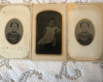 Three Tintypes of children , two are same child, one a toddler, all in paper frames. Fashion.