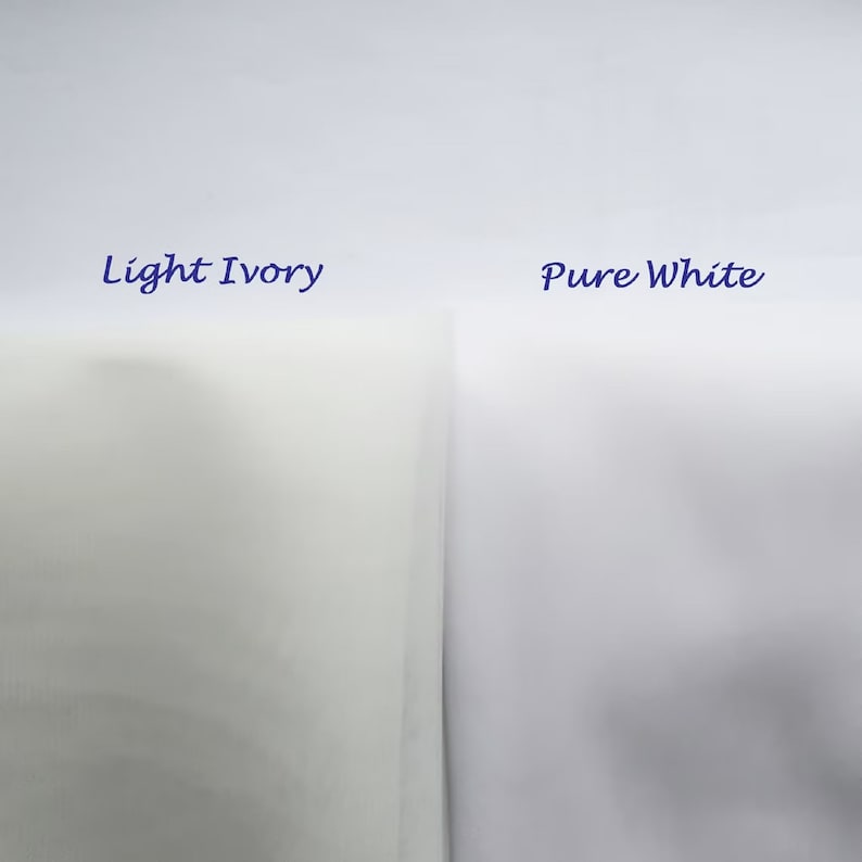 May include: Two fabric swatches, one labeled "Light Ivory" and the other "Pure White". The ivory swatch is a pale cream color, while the white swatch is a bright white.